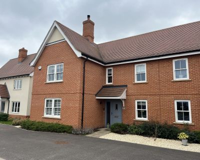 Semi-detached house in Phase 1 of the 20-house development featuring red brick exterior and pitched roof.