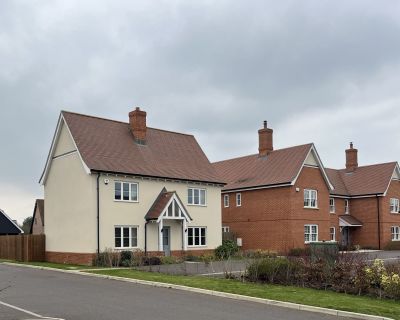 Newly built houses in Phase 1 of the residential project, showcasing traditional architecture style.